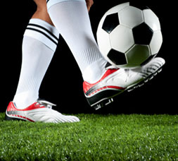 Foot Kicking a Soccer Ball